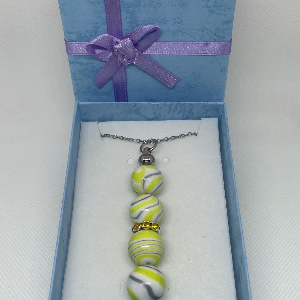 Exquisite Yellow & Silver Swirl Necklace
Expertly Handcrafted, Exclusively Yours